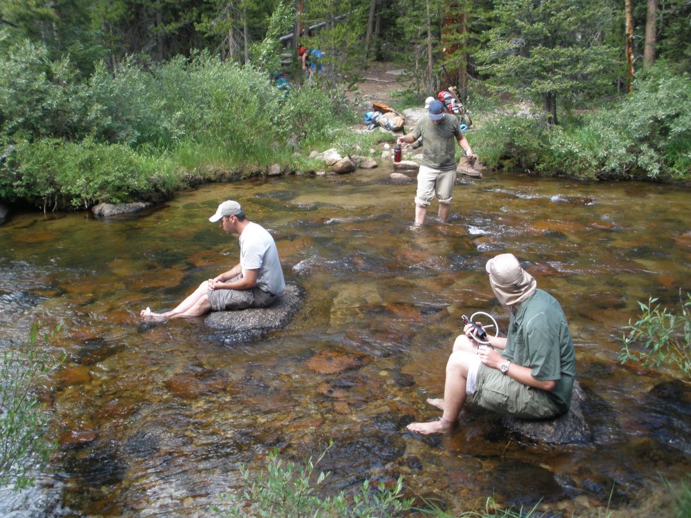 The Professor, Alces, and Photoman Cooling Hot Tired feet at a river crossing.